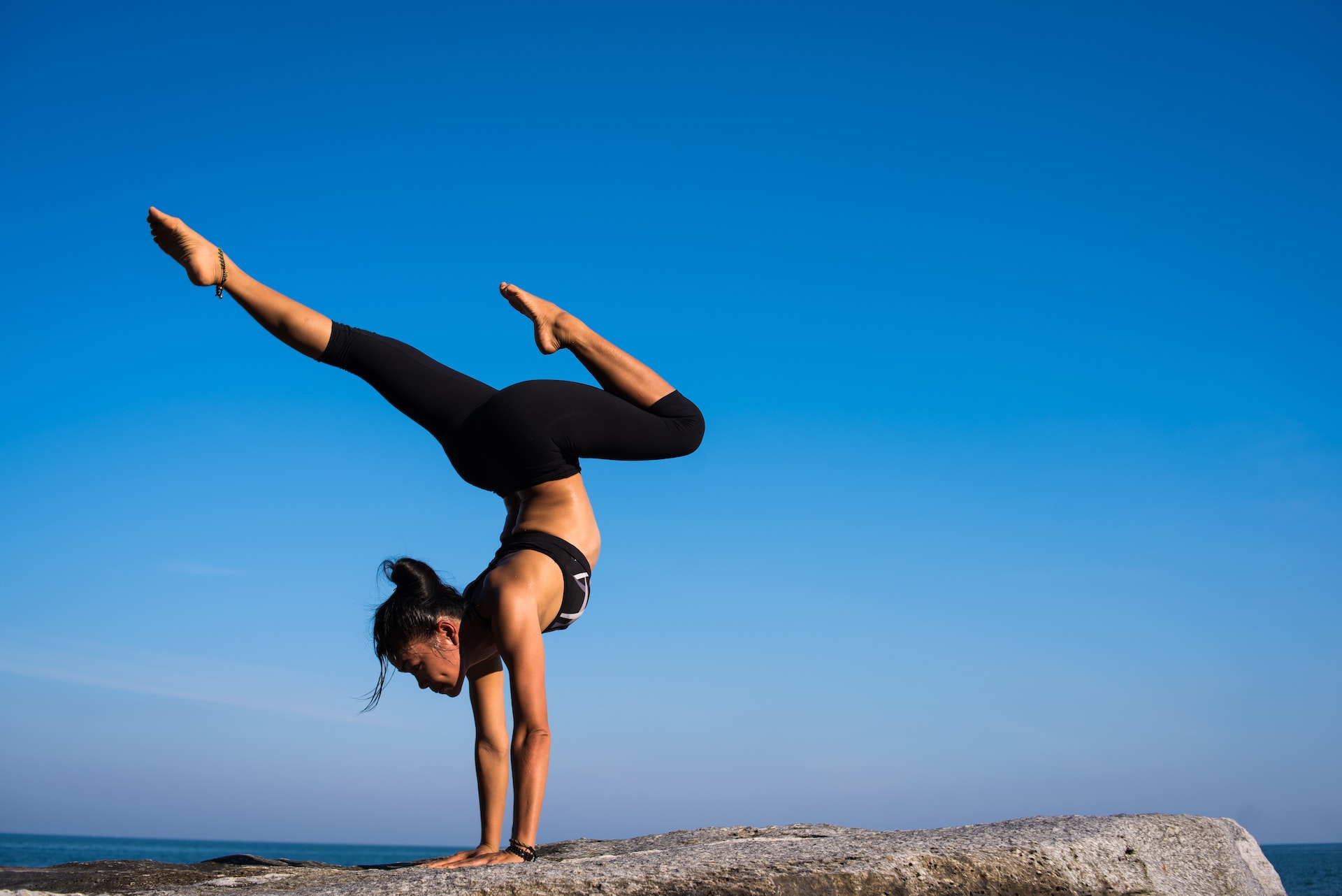 Person reaching goal by handstanding